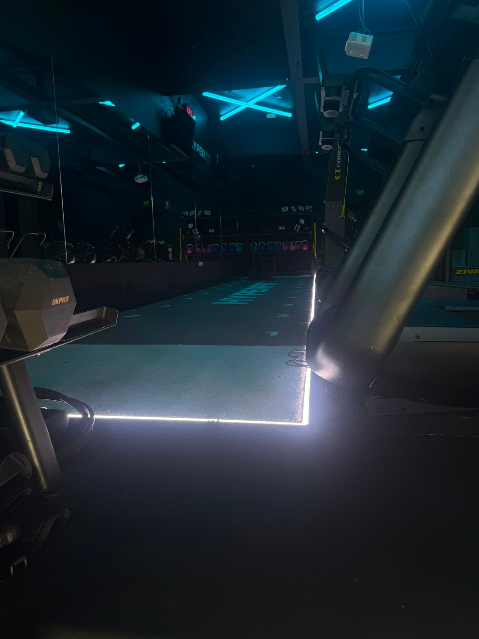 HyperFit training floor with cyan neon lighting