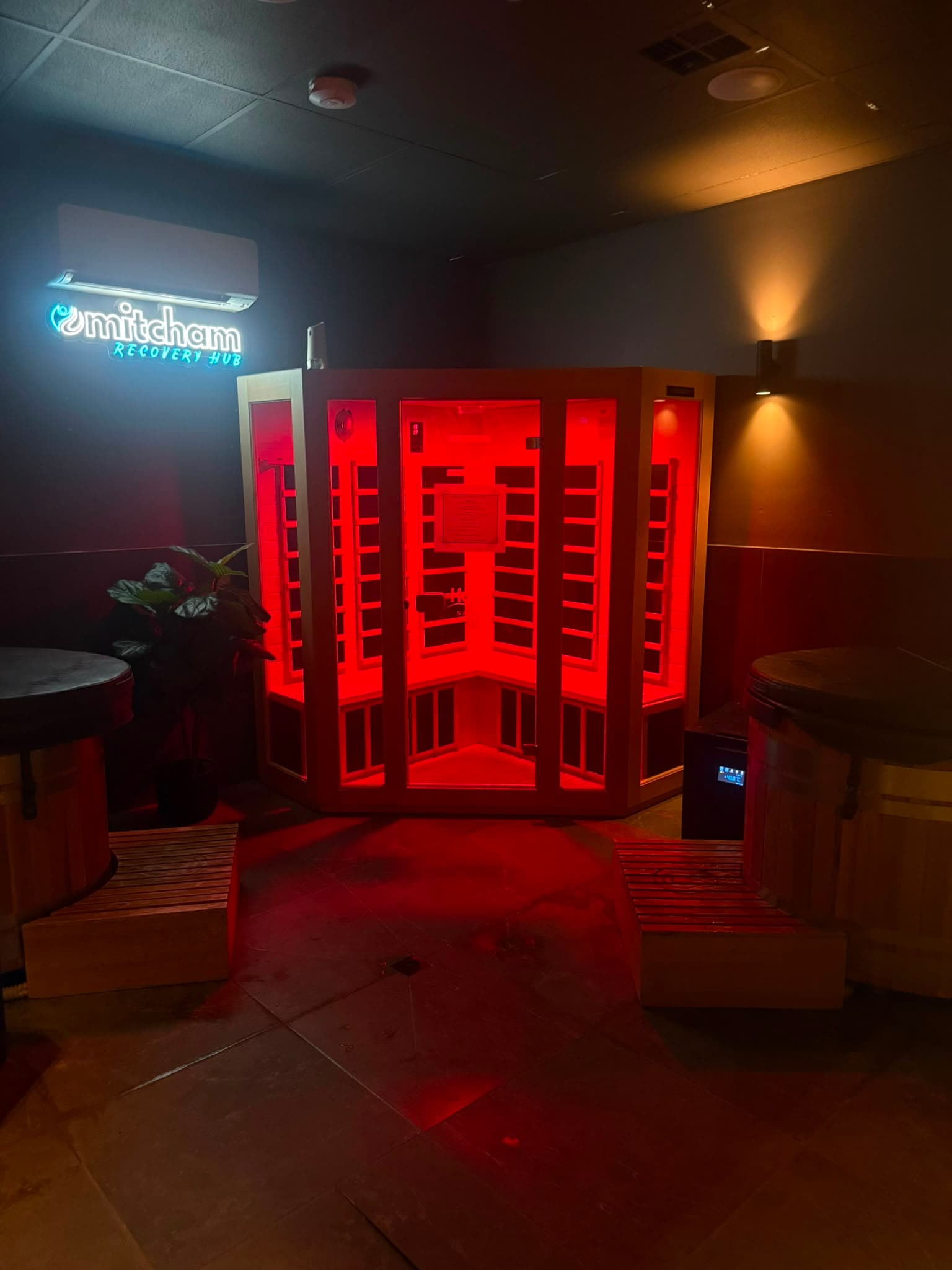 Infrared sauna glowing red in the Mitcham Recovery Hub